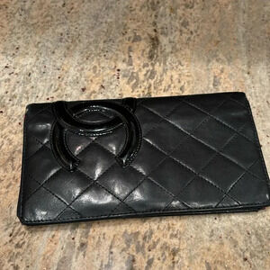 Chanel black long leather wallet with pink leather inside
